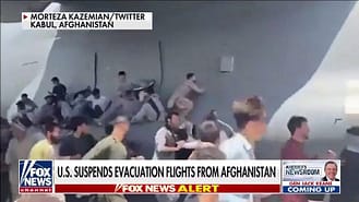 Fox News image of Afghans desperate to escape cling to USAF plane